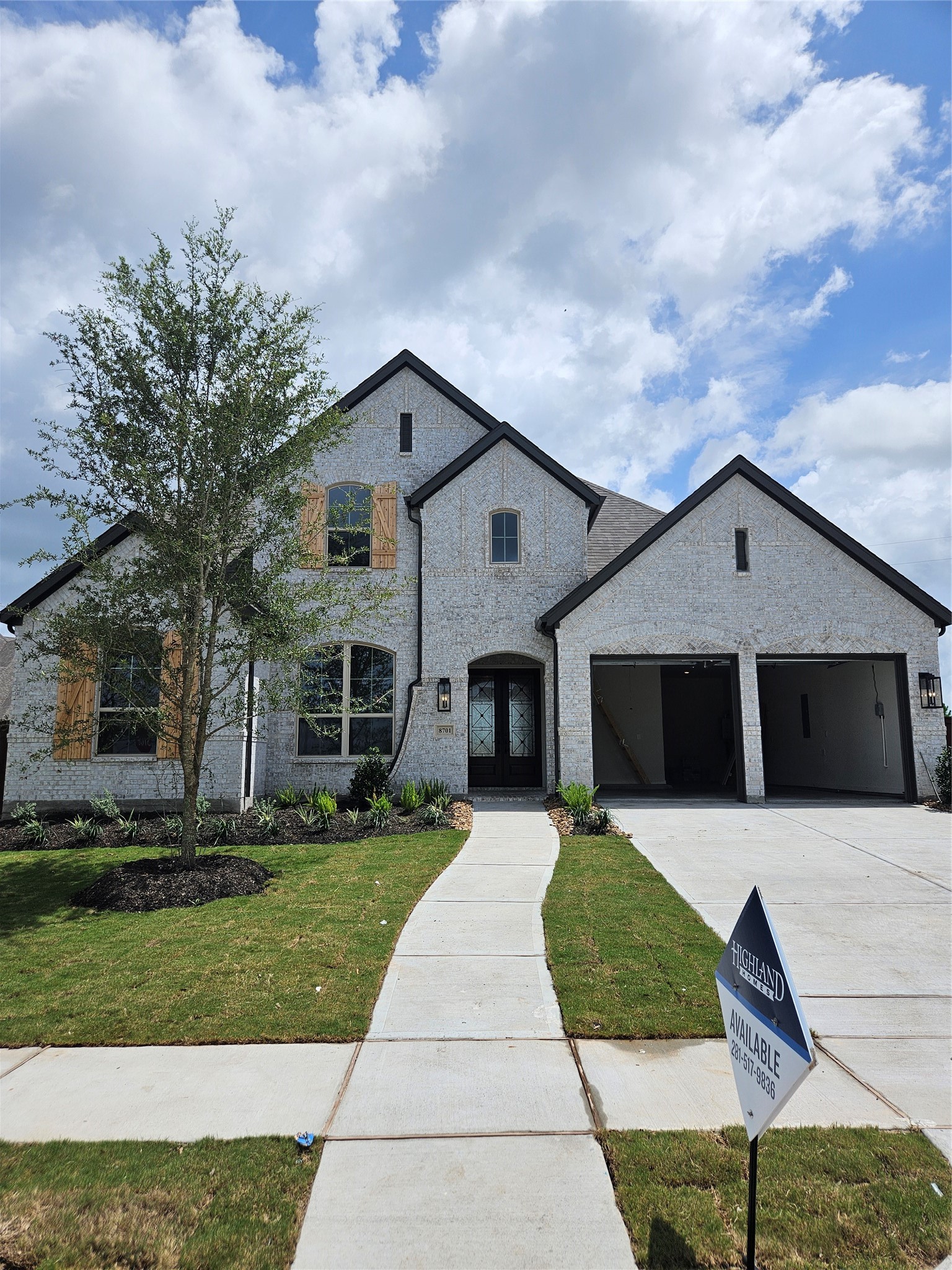8701 Antelope Cyn Way Manvel, TX 77578 - Photo 1 of 32 a front view of a house with a yard and garage