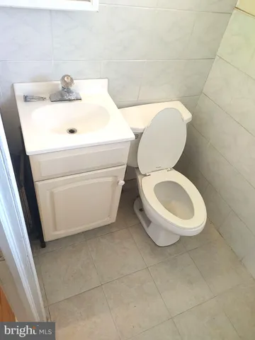 a bathroom with a toilet and a sink