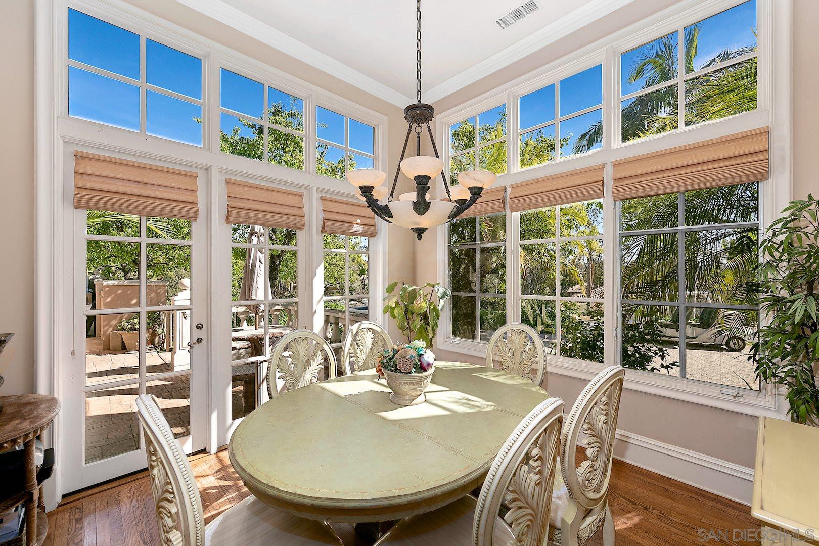 7583 St Andrews Road Rancho Santa Fe, CA 92067 - Photo 11 of 29 a view of a dining room with furniture window and wooden floor