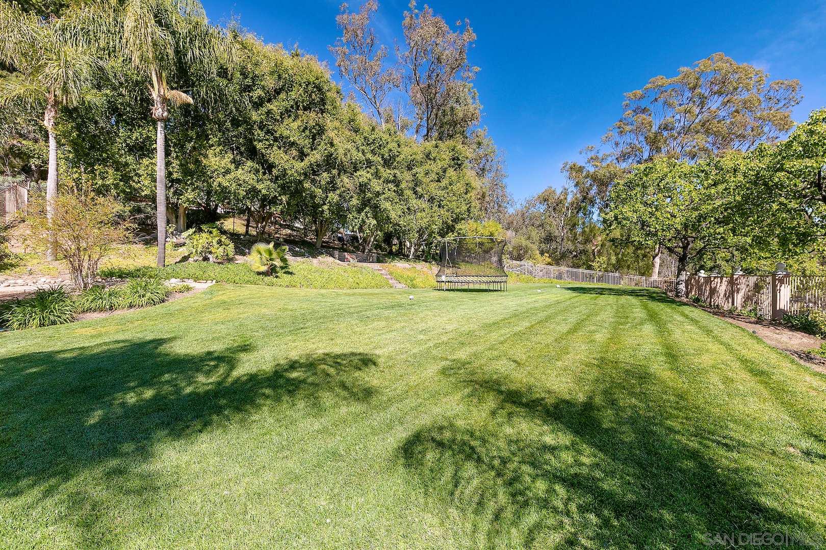 7583 St Andrews Road Rancho Santa Fe, CA 92067 - Photo 22 of 29 a view of an outdoor space and swimming pool