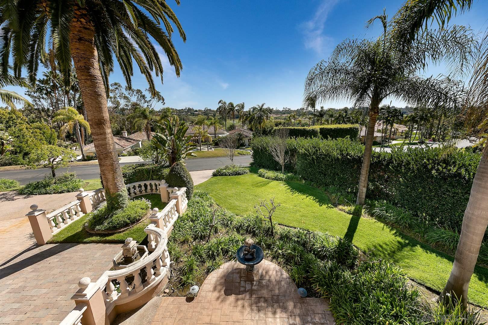 7583 St Andrews Road Rancho Santa Fe, CA 92067 - Photo 24 of 29 a view of a swimming pool with a yard