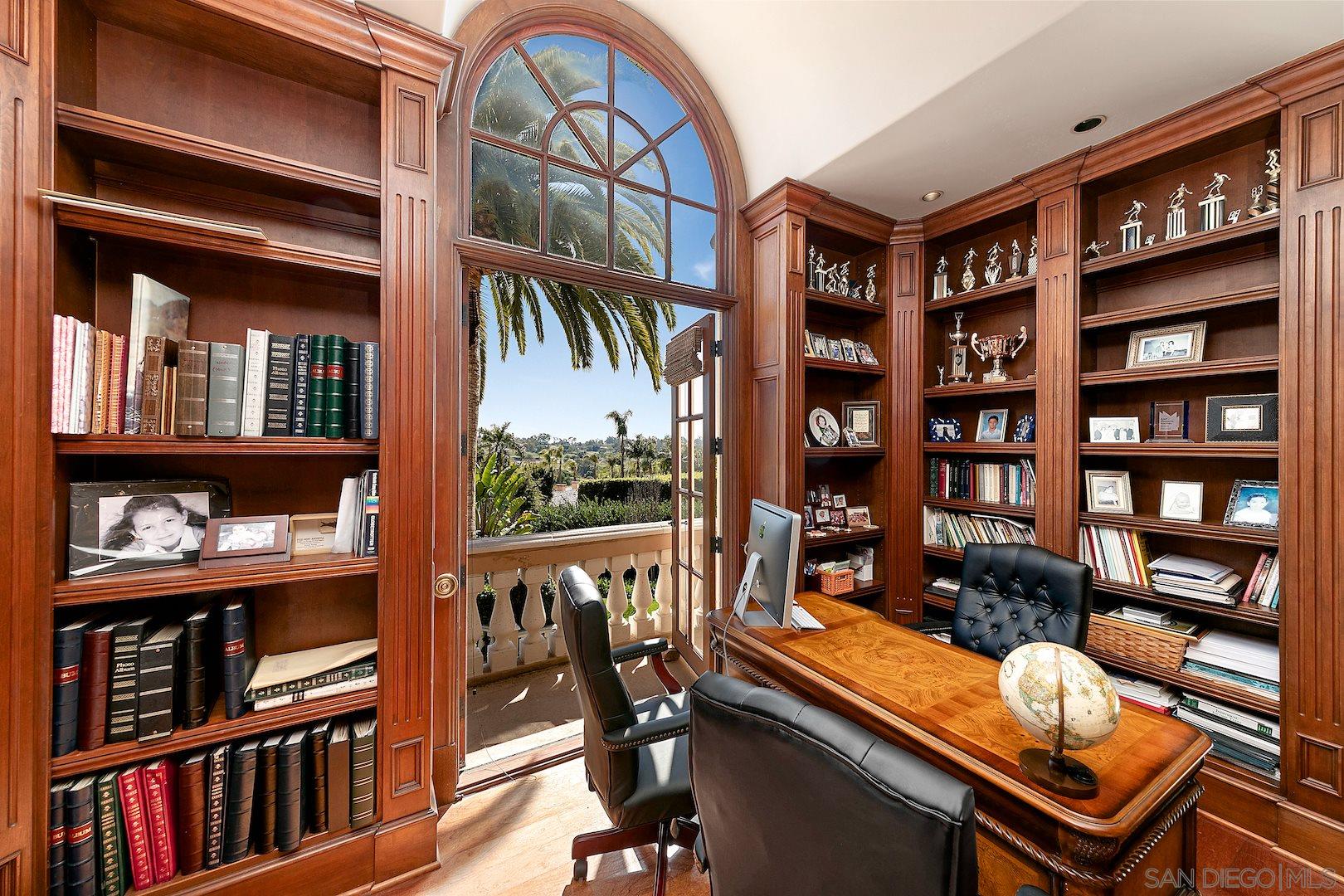 7583 St Andrews Road Rancho Santa Fe, CA 92067 - Photo 9 of 29 a room with furniture cabinets and book shelf