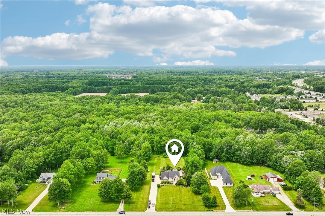 8874 Sharp Road Olmsted Falls, OH 44138 - Photo 39 of 42 Aerial perspective showcasing a property surrounded by expansive wooded areas