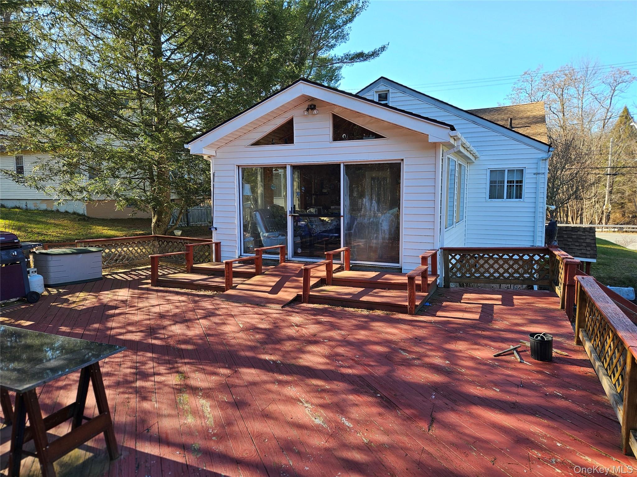 3624 State Rte 55 Kauneonga Lake, NY 12749 - Photo 14 of 40 a view of a house with backyard and sitting area
