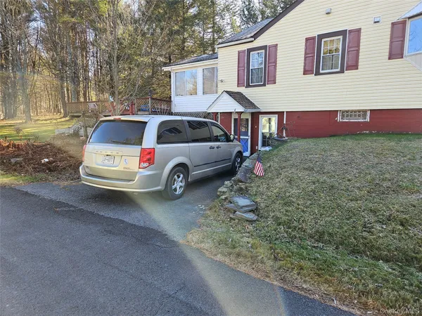 a car parked in front of a house