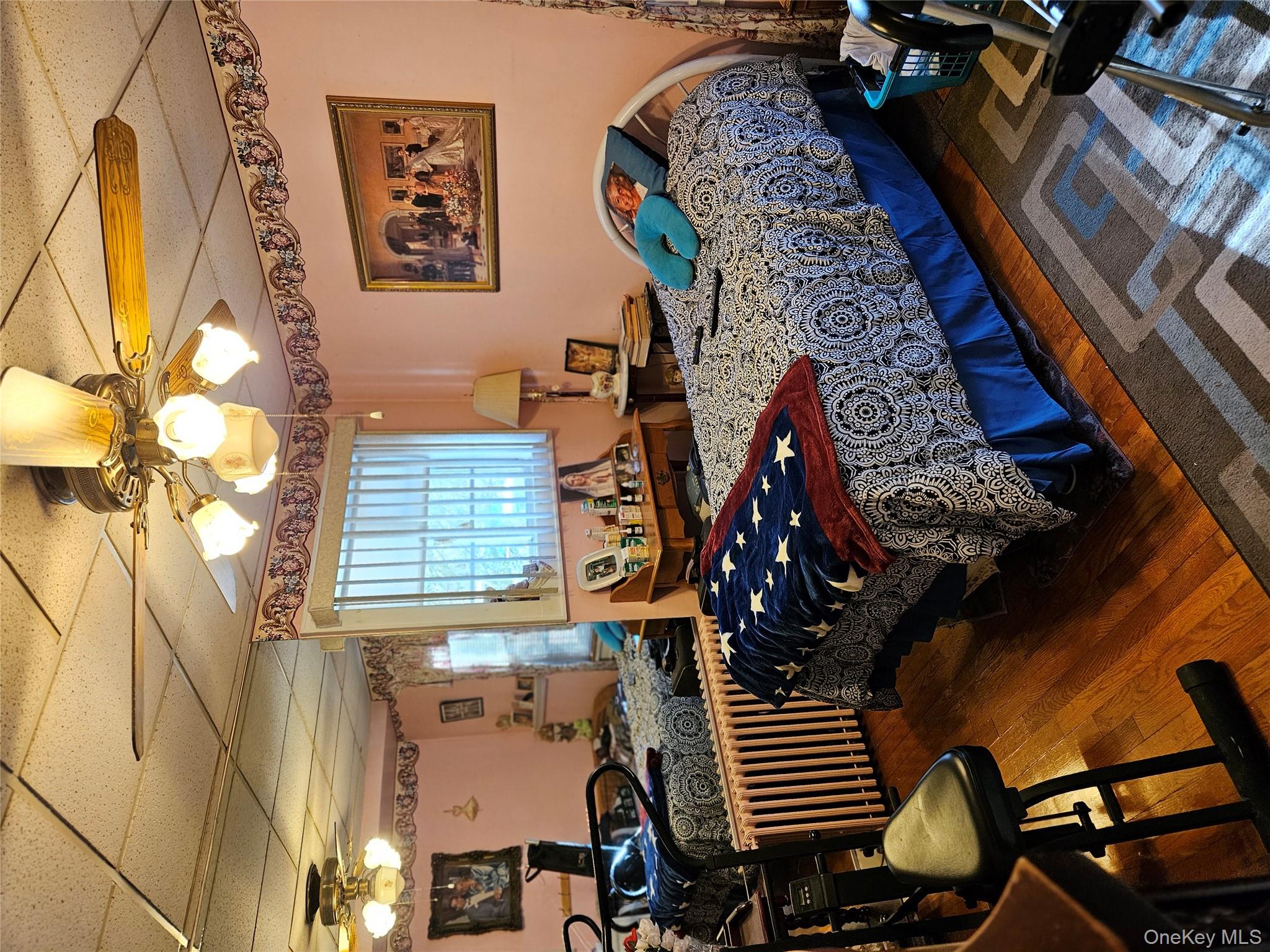 3624 State Rte 55 Kauneonga Lake, NY 12749 - Photo 8 of 40 a bedroom with bed and a window