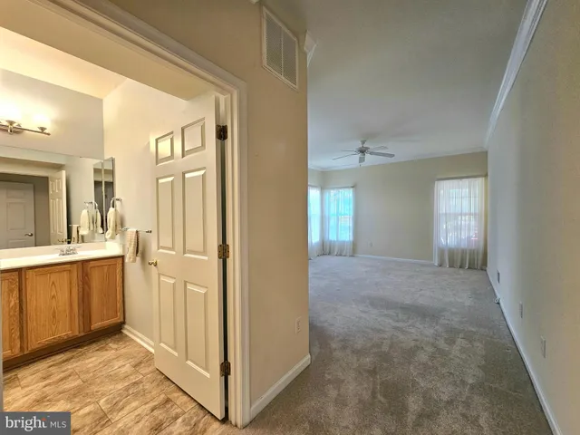 a view of a bathroom with sink and mirror