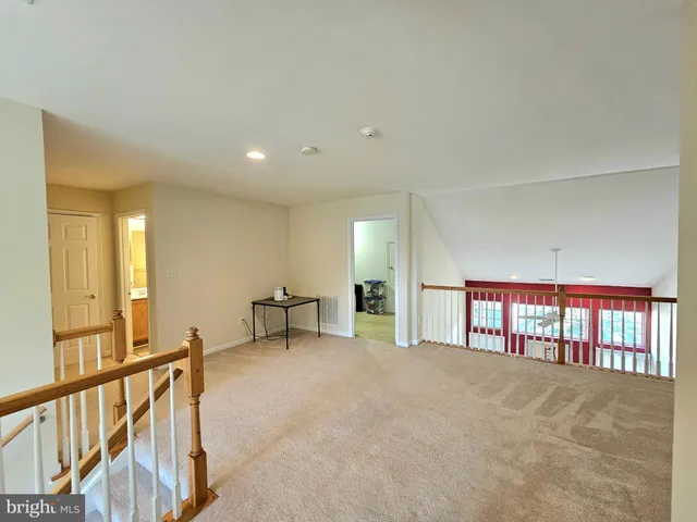 a view of an empty room with windows