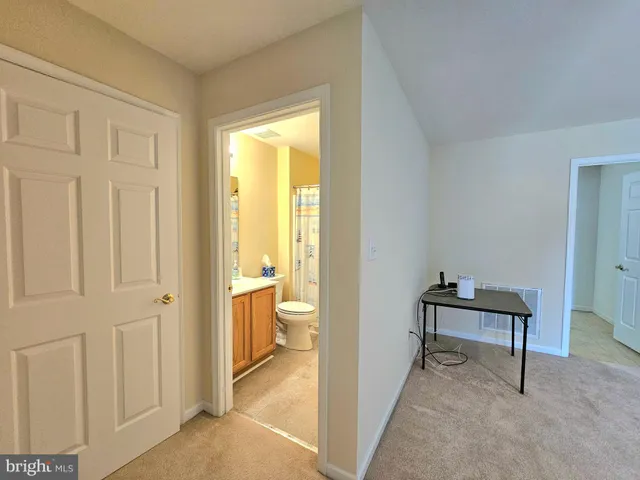 a room that has a bed and a chair in it