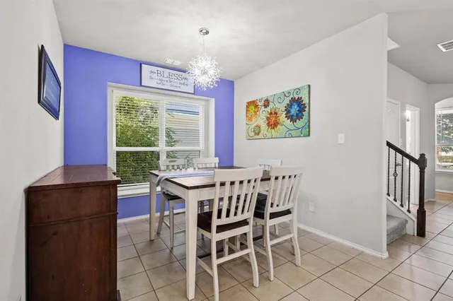 a view of a dining room with furniture window and outside view