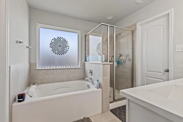 a bathroom with a sink vanity and a mirror