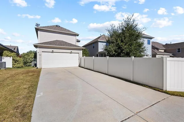 a view of a chairs and table in backyard