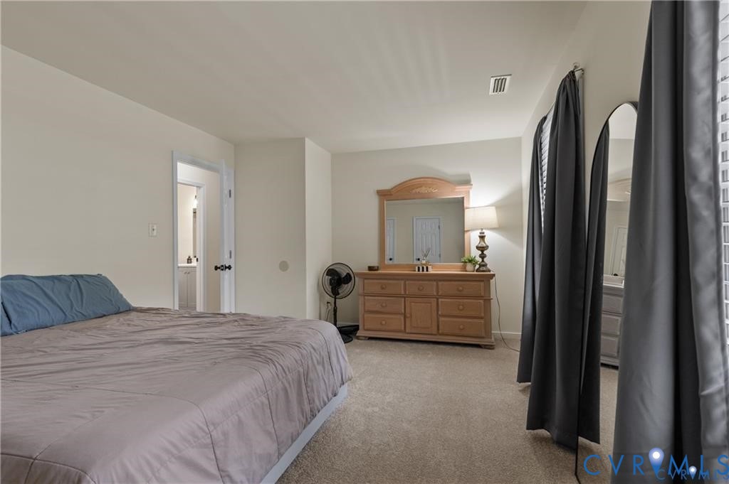 13501 Buck Rub Drive Midlothian, VA 23112 - Photo 14 of 35 a room with a bed and a mirror