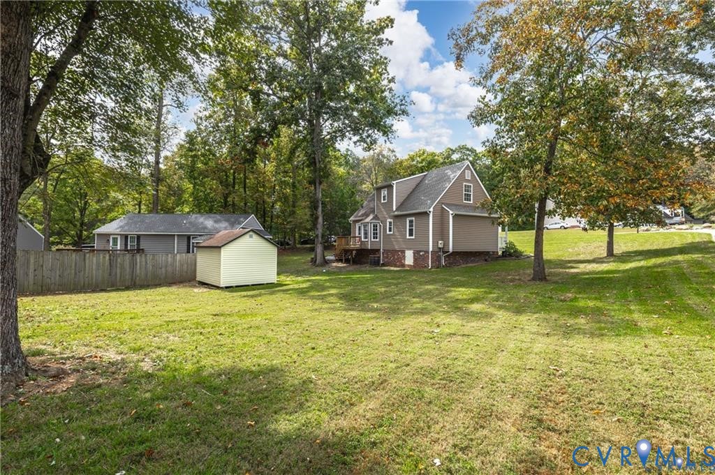 13501 Buck Rub Drive Midlothian, VA 23112 - Photo 27 of 35 a house with huge green field in front of it