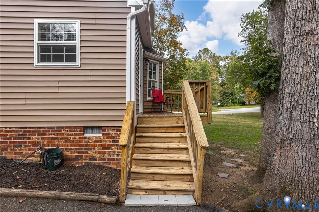 13501 Buck Rub Drive Midlothian, VA 23112 - Photo 30 of 35 a view of a deck with a door and a yard