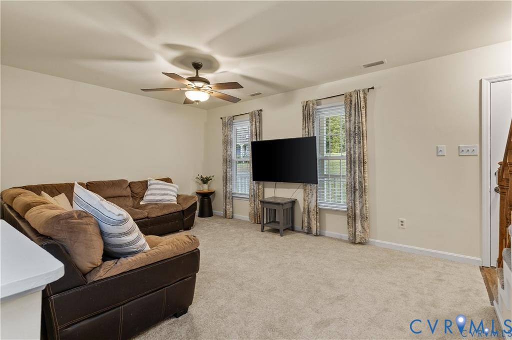 13501 Buck Rub Drive Midlothian, VA 23112 - Photo 6 of 35 a living room with furniture and a flat screen tv