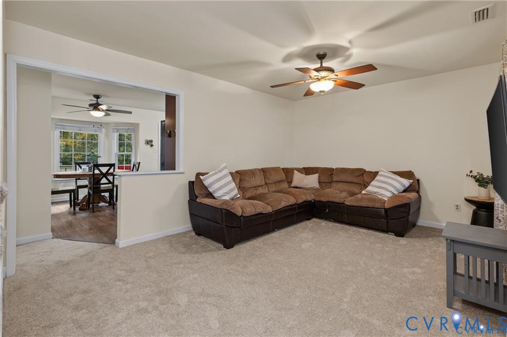 13501 Buck Rub Drive Midlothian, VA 23112 - Photo 7 of 35 a living room with furniture and a chandelier