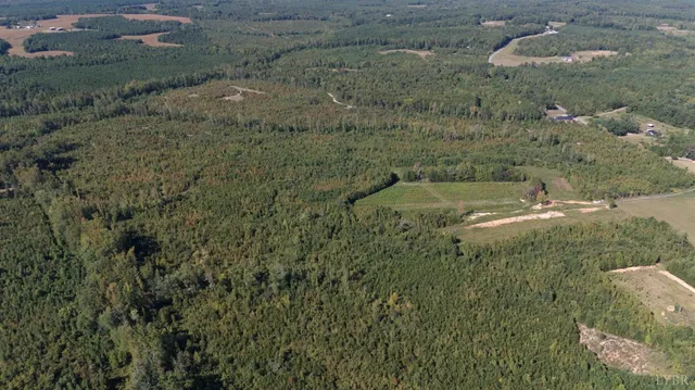 an aerial view of a golf course with swimming pool