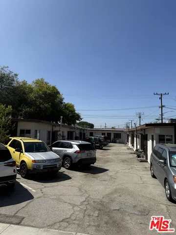 a view of parking with cars parked