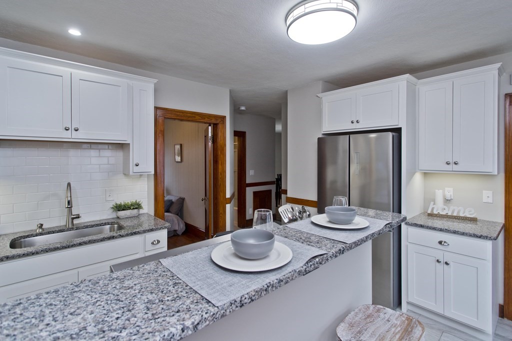 29 Acton Street Springfield, MA 01151 - Photo 1 of 39 a kitchen with sink and refrigerator
