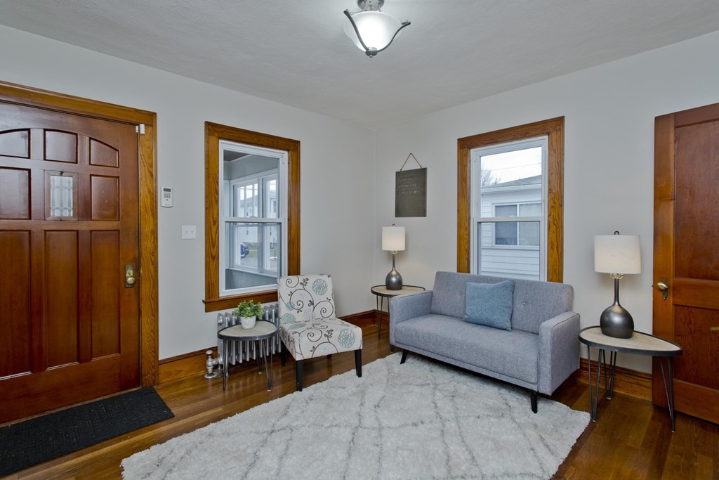 29 Acton Street Springfield, MA 01151 - Photo 18 of 39 a living room with furniture and a window