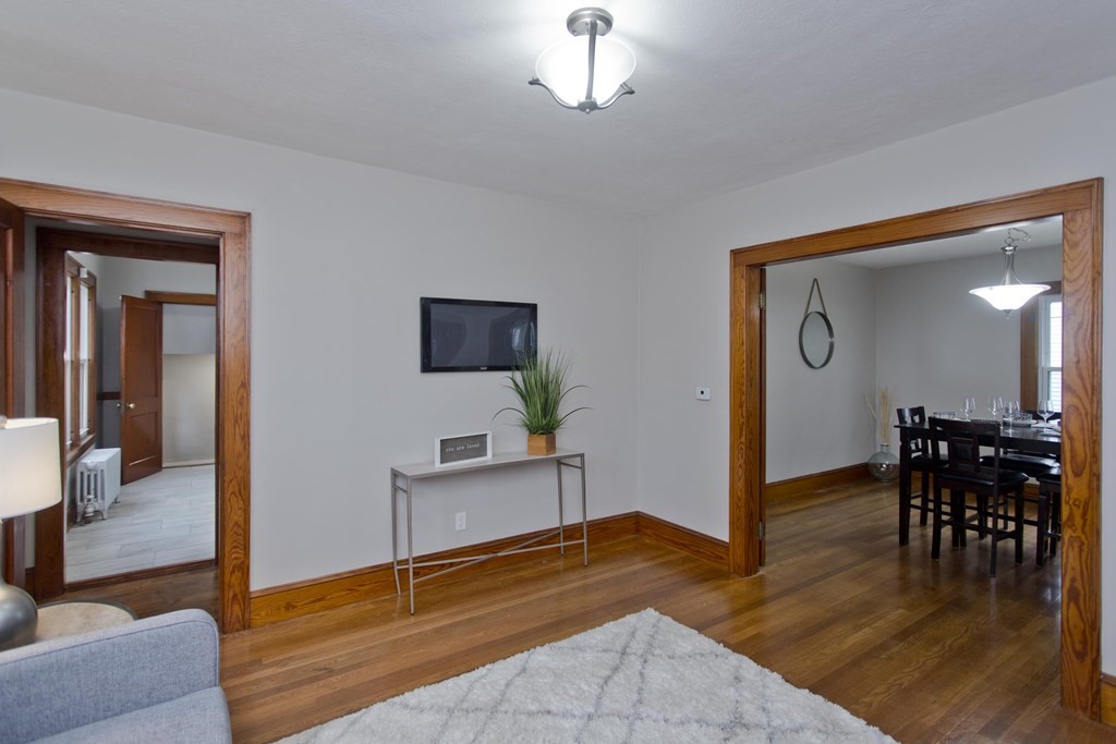 29 Acton Street Springfield, MA 01151 - Photo 20 of 39 a view of a livingroom with furniture and wooden floor
