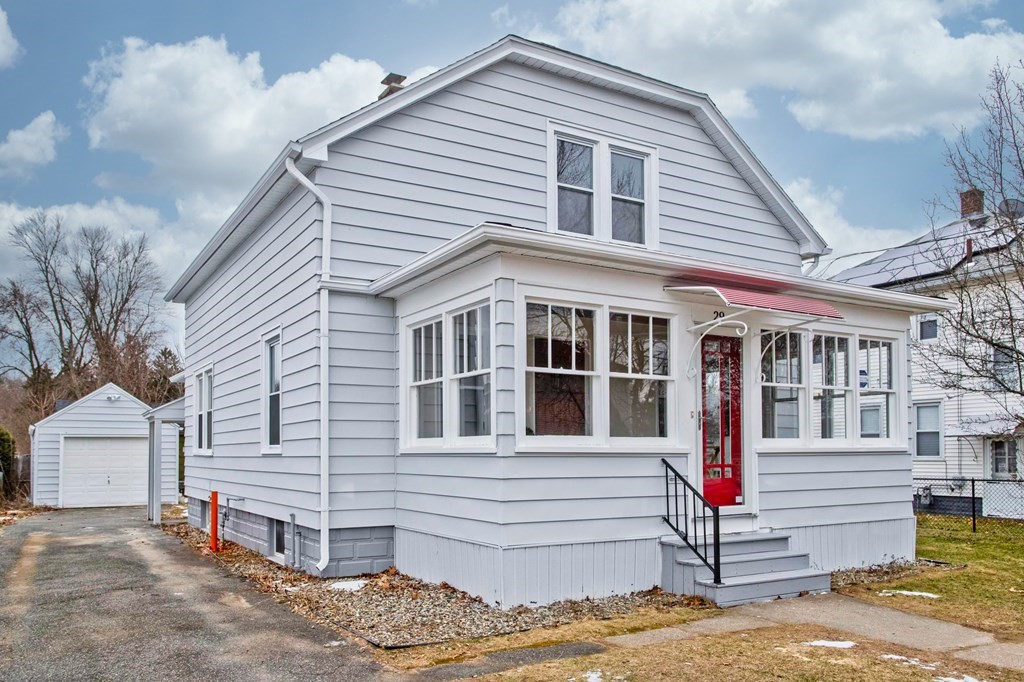 29 Acton Street Springfield, MA 01151 - Photo 2 of 39 a front view of a house with a yard
