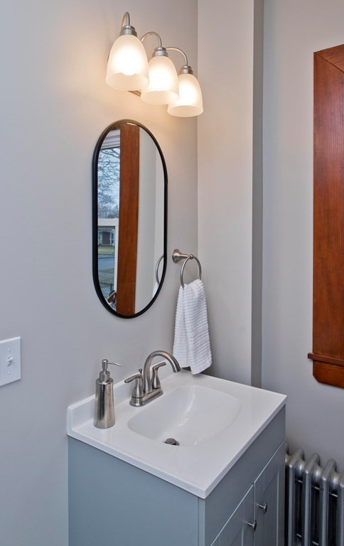 29 Acton Street Springfield, MA 01151 - Photo 23 of 39 a bathroom with a sink and a mirror