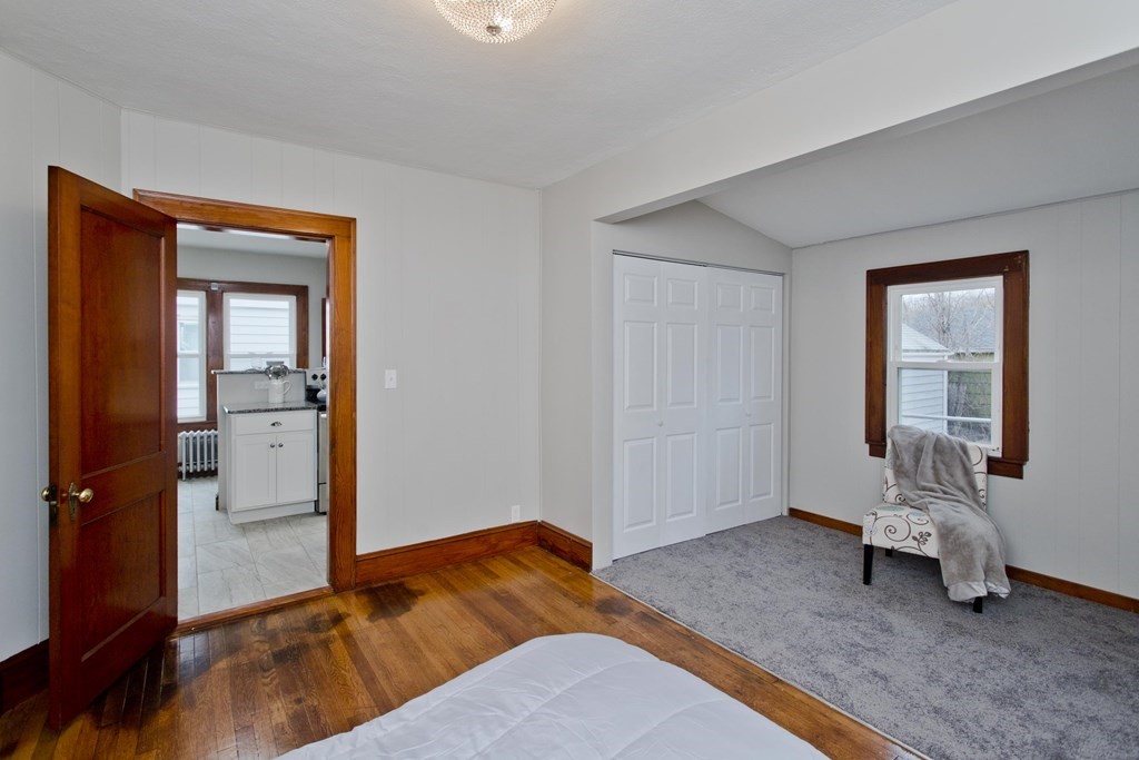29 Acton Street Springfield, MA 01151 - Photo 25 of 39 a bedroom with a bed and a mirror