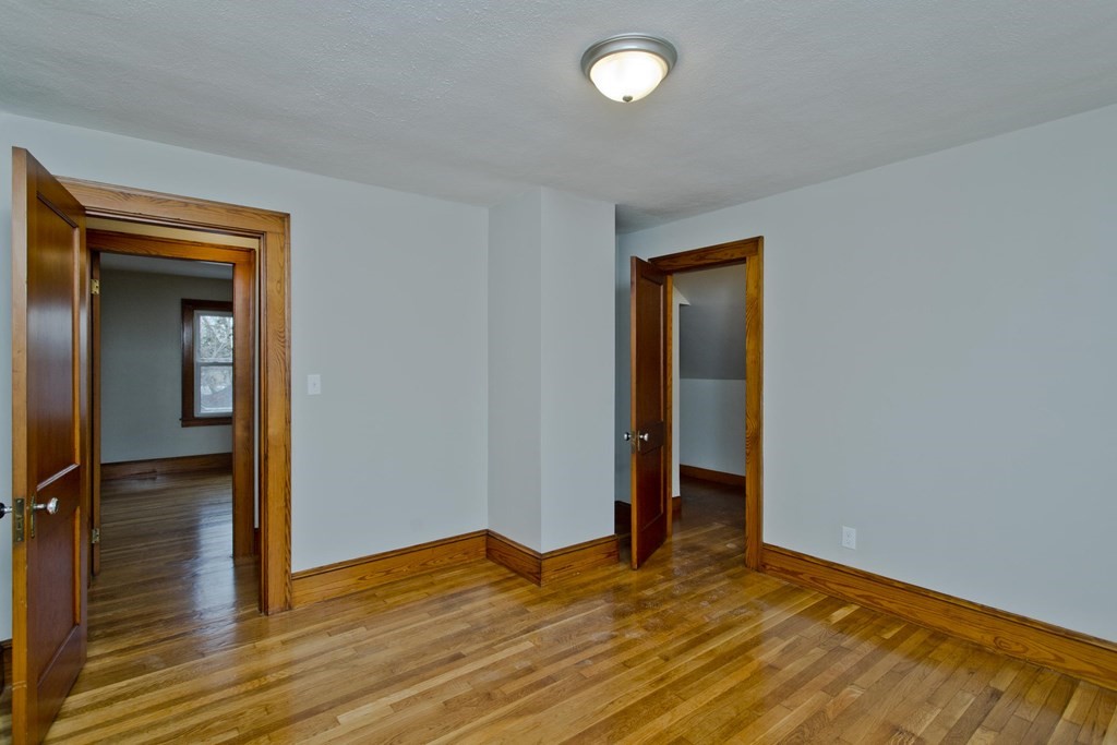29 Acton Street Springfield, MA 01151 - Photo 28 of 39 a view of empty room with wooden floor
