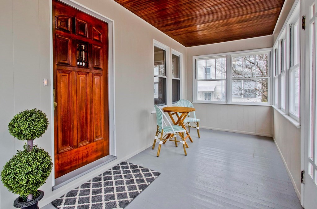 29 Acton Street Springfield, MA 01151 - Photo 3 of 39 a view of a entryway door and dining room