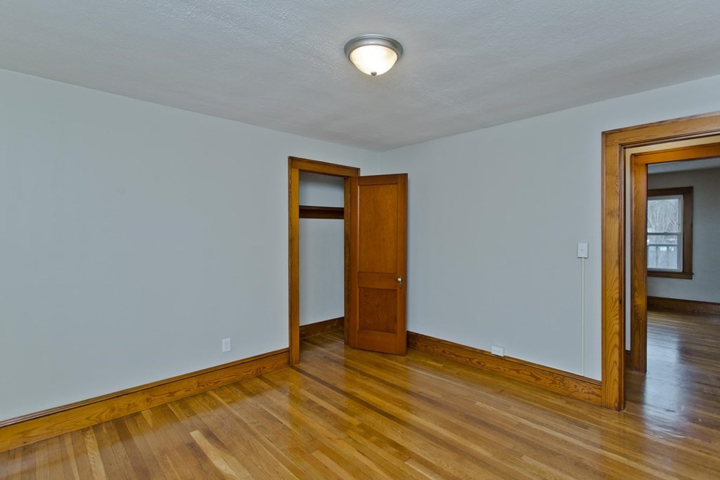 29 Acton Street Springfield, MA 01151 - Photo 32 of 39 a view of empty room with wooden floor