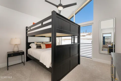 a view of bedroom with furniture and windows