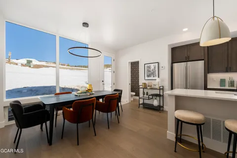 a kitchen with a table and chairs in it