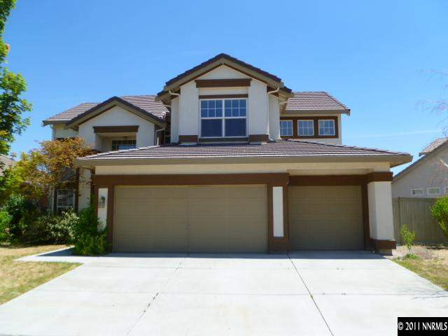 9540 Comanche Moon Drive Reno, NV 89521 - Photo 1 of 1 a front view of a house with a yard