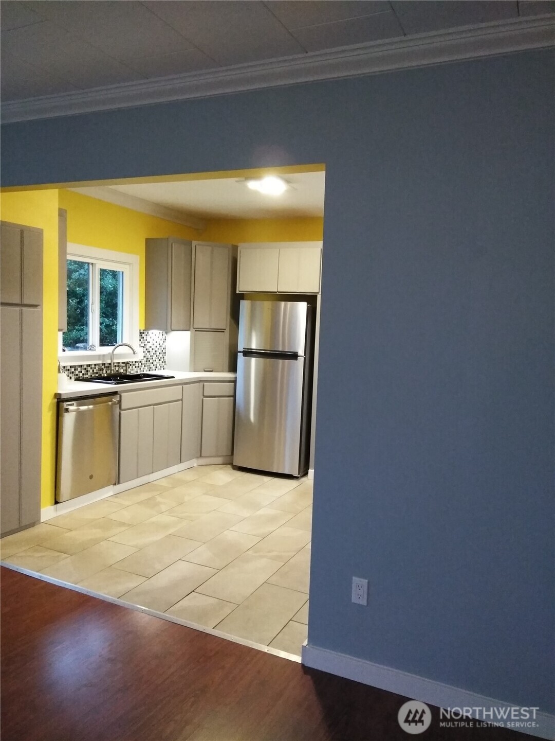 211 Garfield Street Hoquiam, WA 98550 - Photo 14 of 26 a large white kitchen with a sink and cabinets