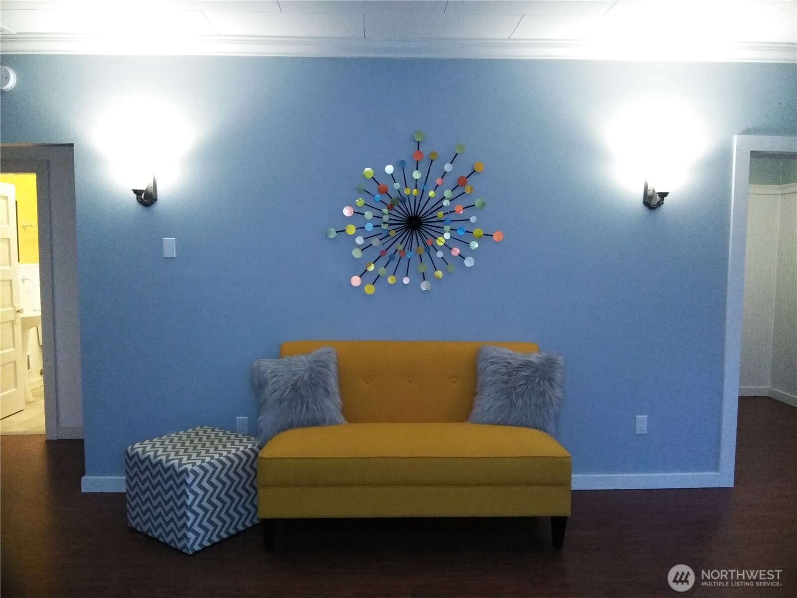211 Garfield Street Hoquiam, WA 98550 - Photo 15 of 26 a blue couch sitting in a living room next to a window