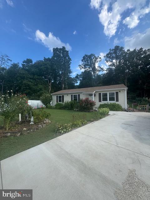 12250 Short Street Remington, VA 22734 - Photo 2 of 10 front view of house with a yard and lake view