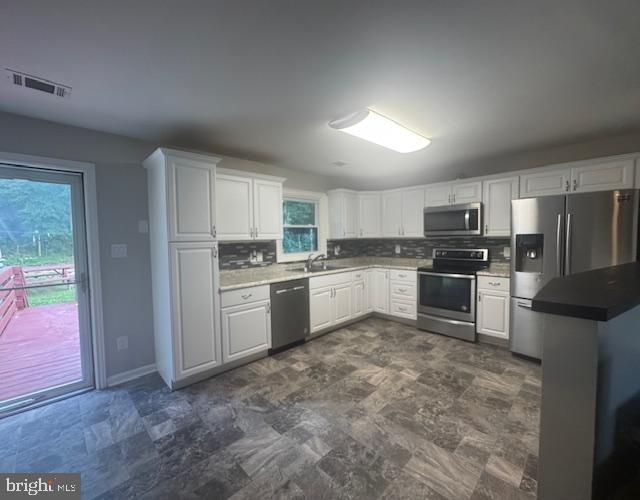 12250 Short Street Remington, VA 22734 - Photo 4 of 10 a kitchen with a refrigerator sink and cabinets