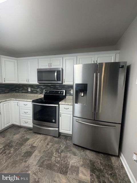 12250 Short Street Remington, VA 22734 - Photo 5 of 10 a kitchen with a refrigerator stove and microwave