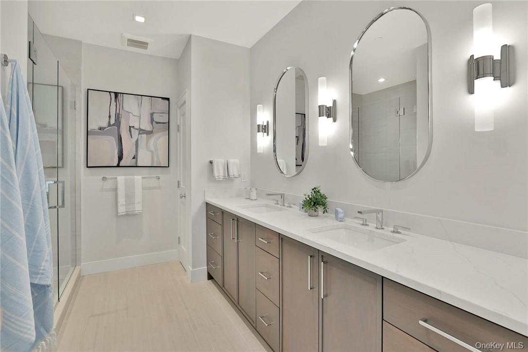 162 Bedford Road, Unit 16 Armonk, NY 10504 - Photo 12 of 37 a spacious bathroom with a double vanity sink and a mirror