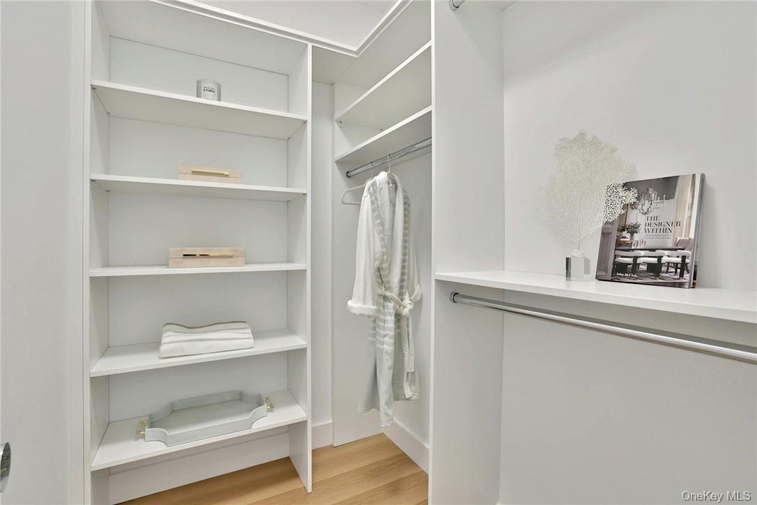 162 Bedford Road, Unit 16 Armonk, NY 10504 - Photo 15 of 37 a view of walk in closet with empty racks
