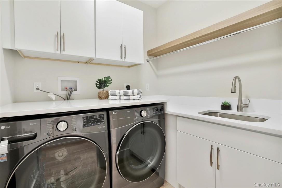 162 Bedford Road, Unit 16 Armonk, NY 10504 - Photo 16 of 37 a utility room with sink dryer and washer