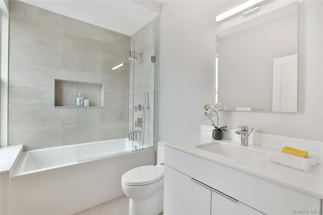 162 Bedford Road, Unit 16 Armonk, NY 10504 - Photo 18 of 37 a bathroom with a sink a toilet and shower