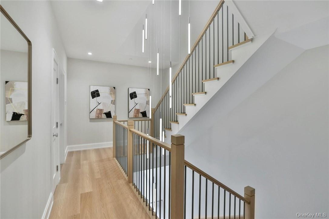 162 Bedford Road, Unit 16 Armonk, NY 10504 - Photo 19 of 37 a view of a hallway with wooden floor and entryway