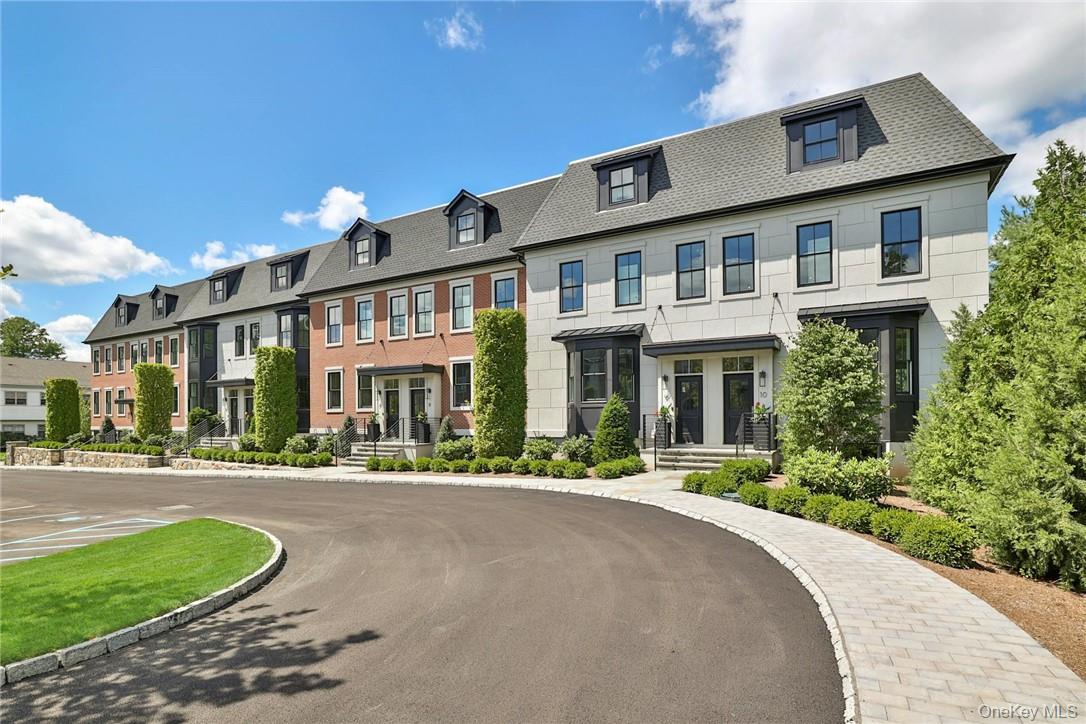162 Bedford Road, Unit 16 Armonk, NY 10504 - Photo 2 of 37 a front view of a building with a garden