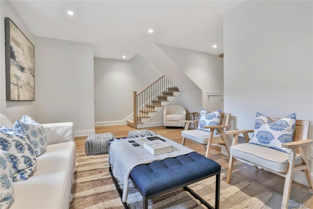 162 Bedford Road, Unit 16 Armonk, NY 10504 - Photo 25 of 37 a living room with furniture and wooden floor