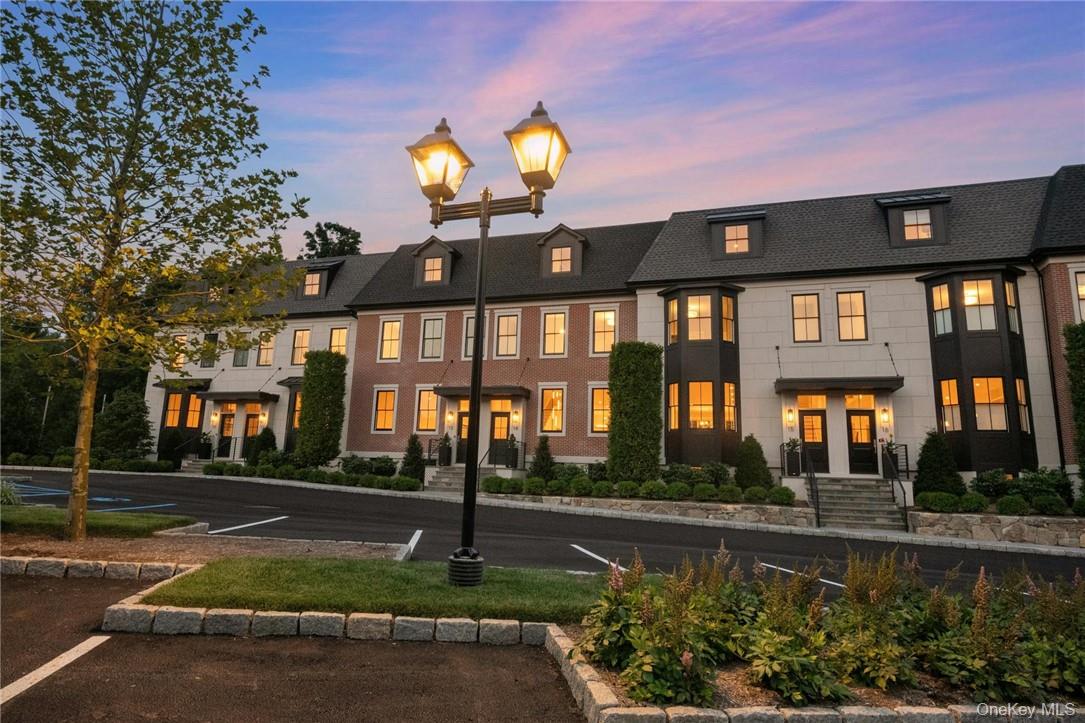162 Bedford Road, Unit 16 Armonk, NY 10504 - Photo 31 of 37 a front view of a house with garden