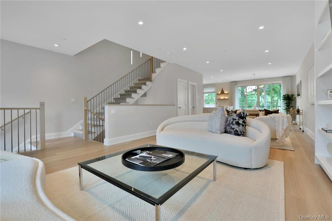 162 Bedford Road, Unit 16 Armonk, NY 10504 - Photo 4 of 37 a living room with furniture and wooden floor