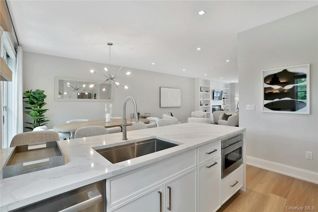 162 Bedford Road, Unit 16 Armonk, NY 10504 - Photo 8 of 37 a kitchen with a sink and white cabinets